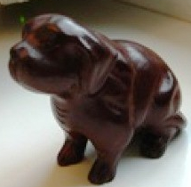 Rosewood dog, hand-carved in traditional business.family